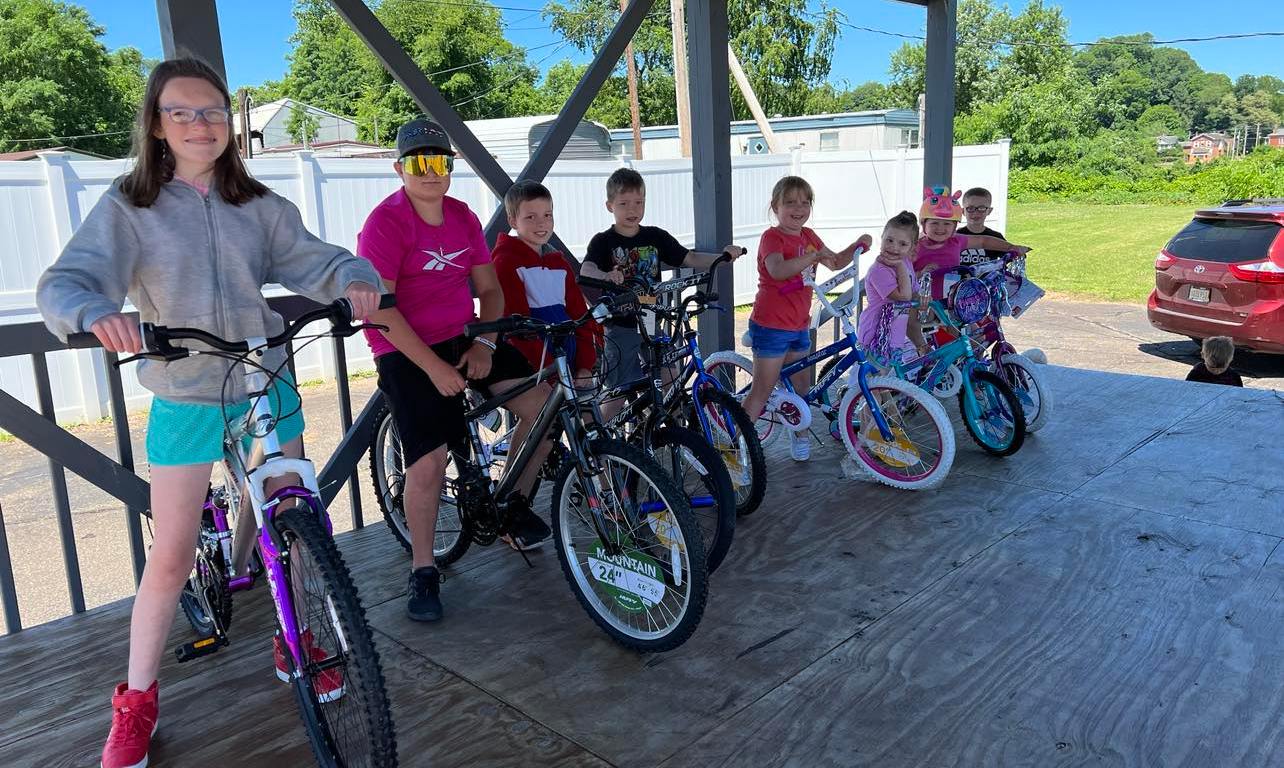 Children on bicycles to promote a bike rodeo.