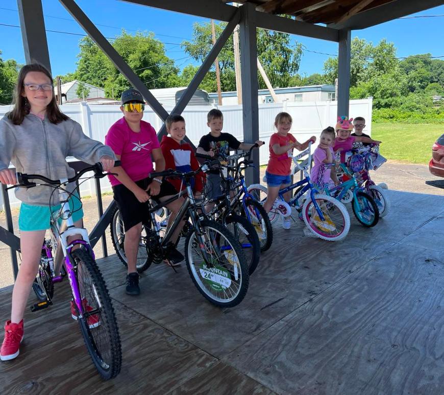 Children on bicycles to promote a bike rodeo.