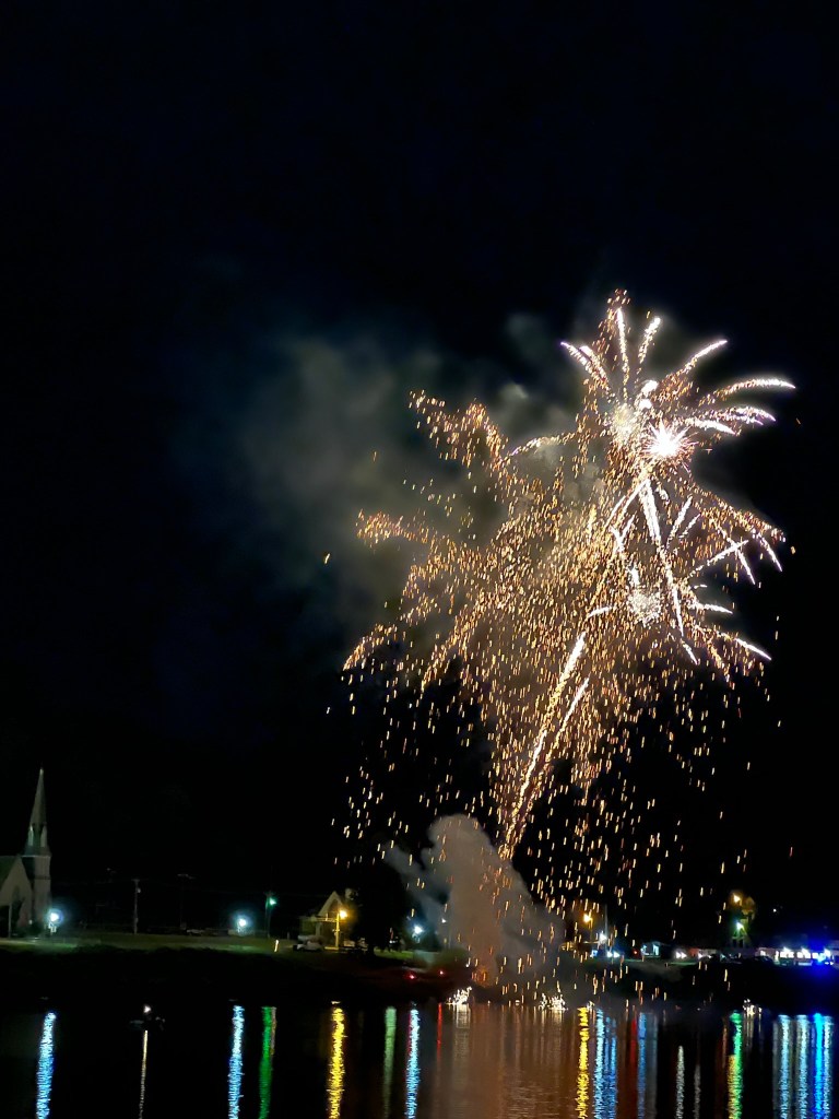 Fireworks explode over the Ohio River. 