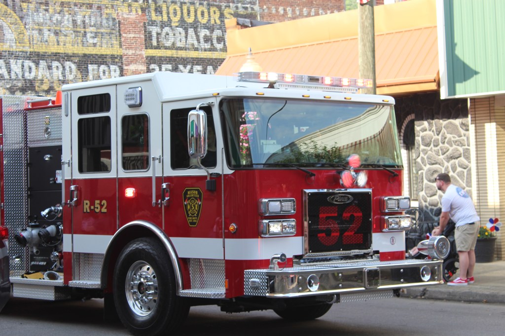 A large firetruck from Mason Fire Department in the parade route.