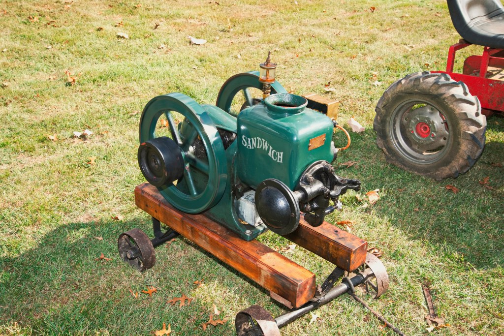 A small antique engine sits on display.