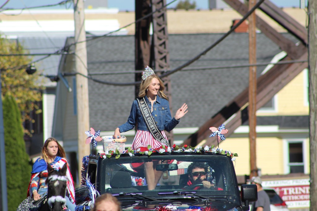 Mason County Fair Queen waves from the route.