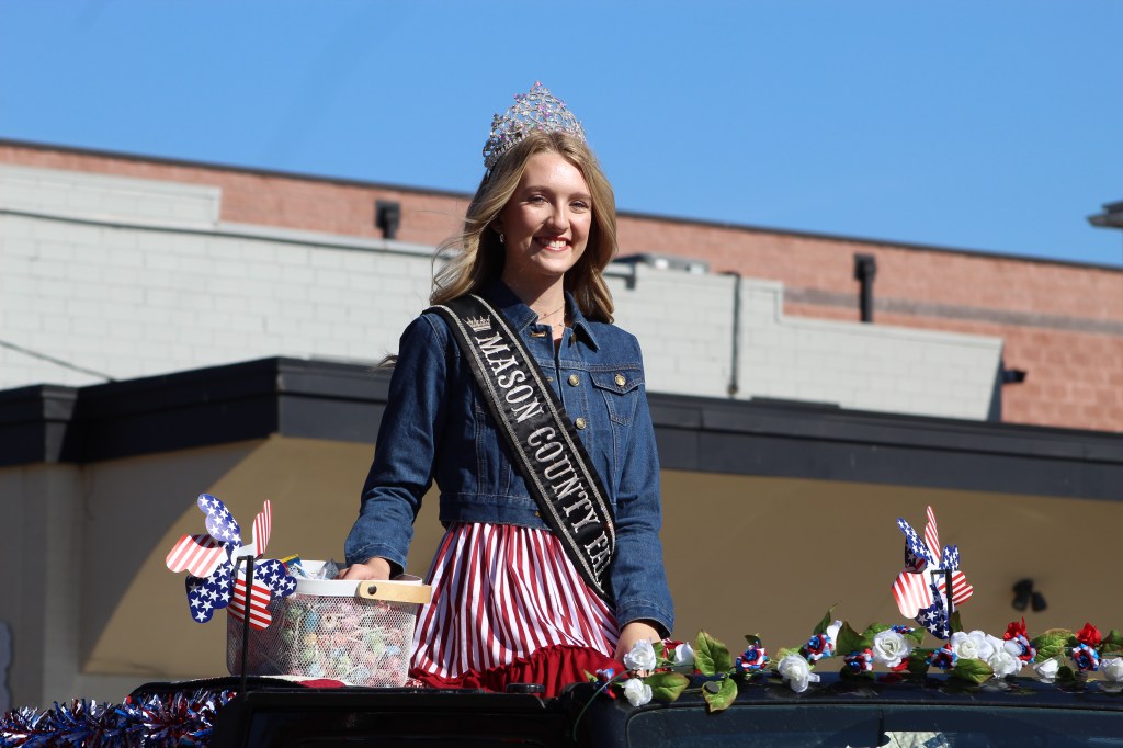 Mason County Fair Queen smiles along the parade route.